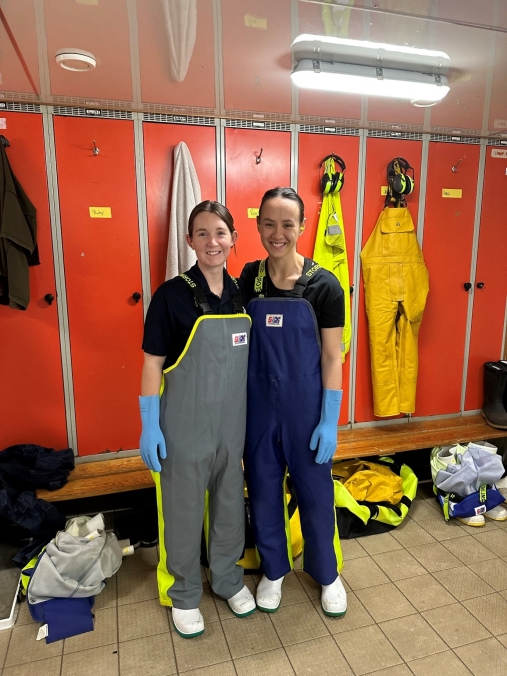 Rose and fellow intern Ruby in their PPE before entering the wet lab onboard Tangaroa, ready to take measurements of caught Orange Roughy.