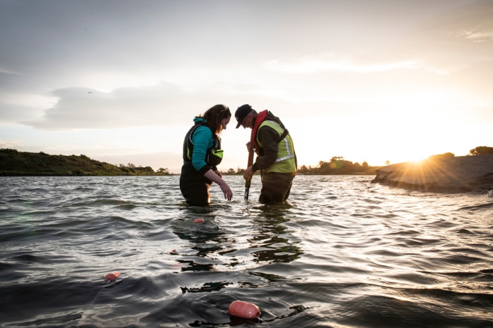 Eimear Egan sampling for glass eels in the Rangitaiki River, Thornton Beach. [Photo: Rebekah Parsons-King, NIWA]