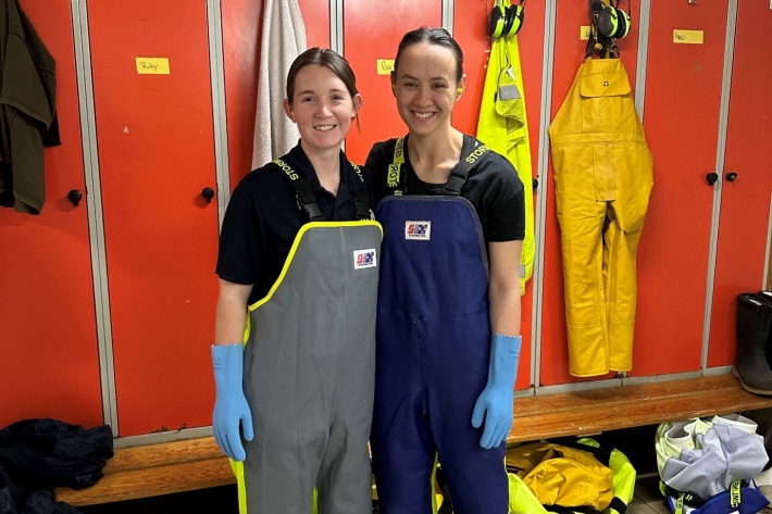 Rose and fellow intern Ruby in their PPE before entering the wet lab onboard Tangaroa, ready to take measurements of caught Orange Roughy.