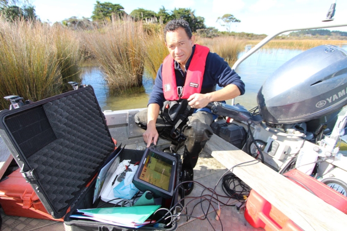 Aquatic biology technician Aleki Taumoepeau on Northland's Lake Ngatu.