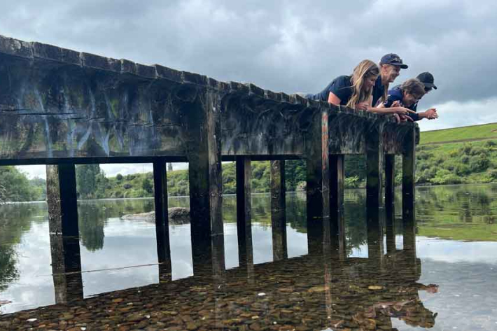 Banner image: They’re not lying down on the job; they’re scanning the lakebed for an invader. Earth Sciences NZ ecologists and visiting clam expert from Ireland, Prof. Frances Lucy, at Bob’s Landing on Lake Karāpiro. 