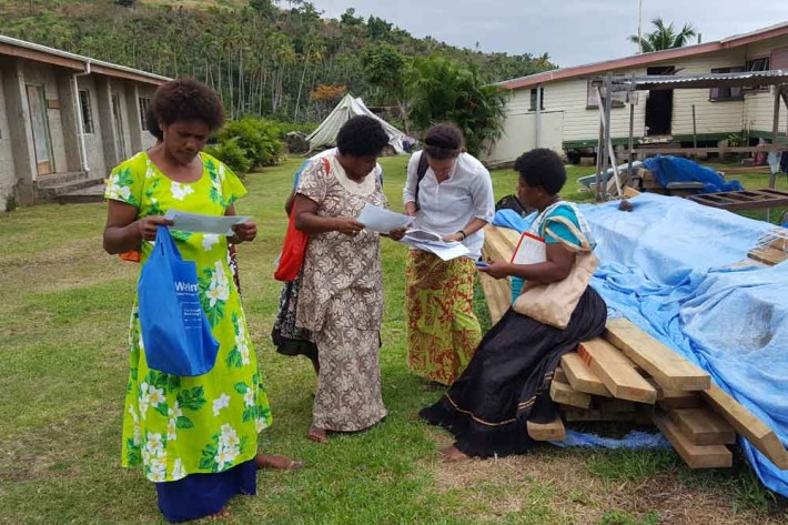 Patrina conducting community interviews in Nabukadra, Fiji.