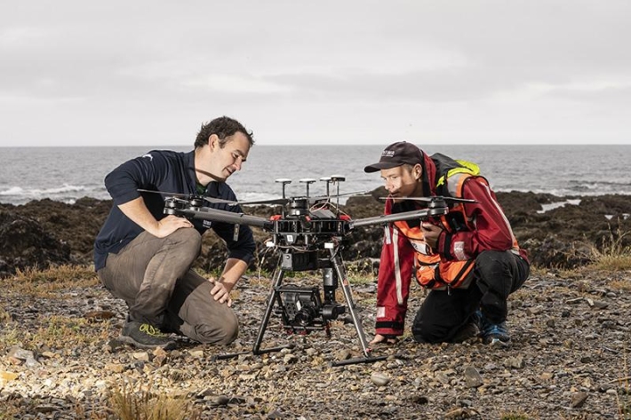 Hamish Sutton and Leigh Tait set up drone for marine reserve mapping image