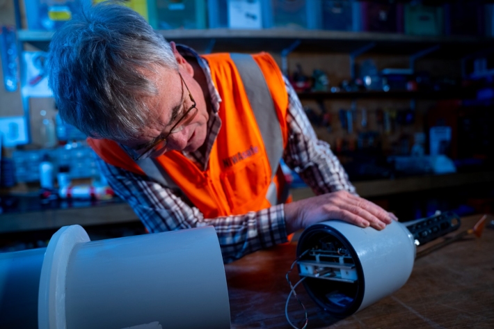 Dr Phil Sutton looking at a decommissioned float