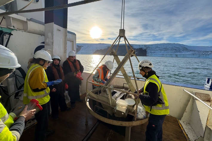 Benthic team huddle around to see what has been collected