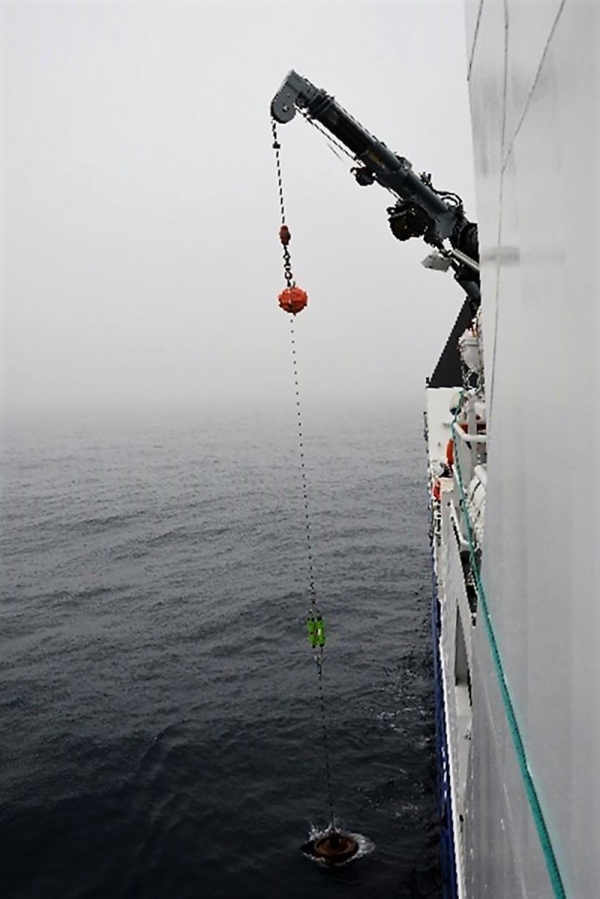 Passive acoustic mooring deployed from side of the ship into ocean water.