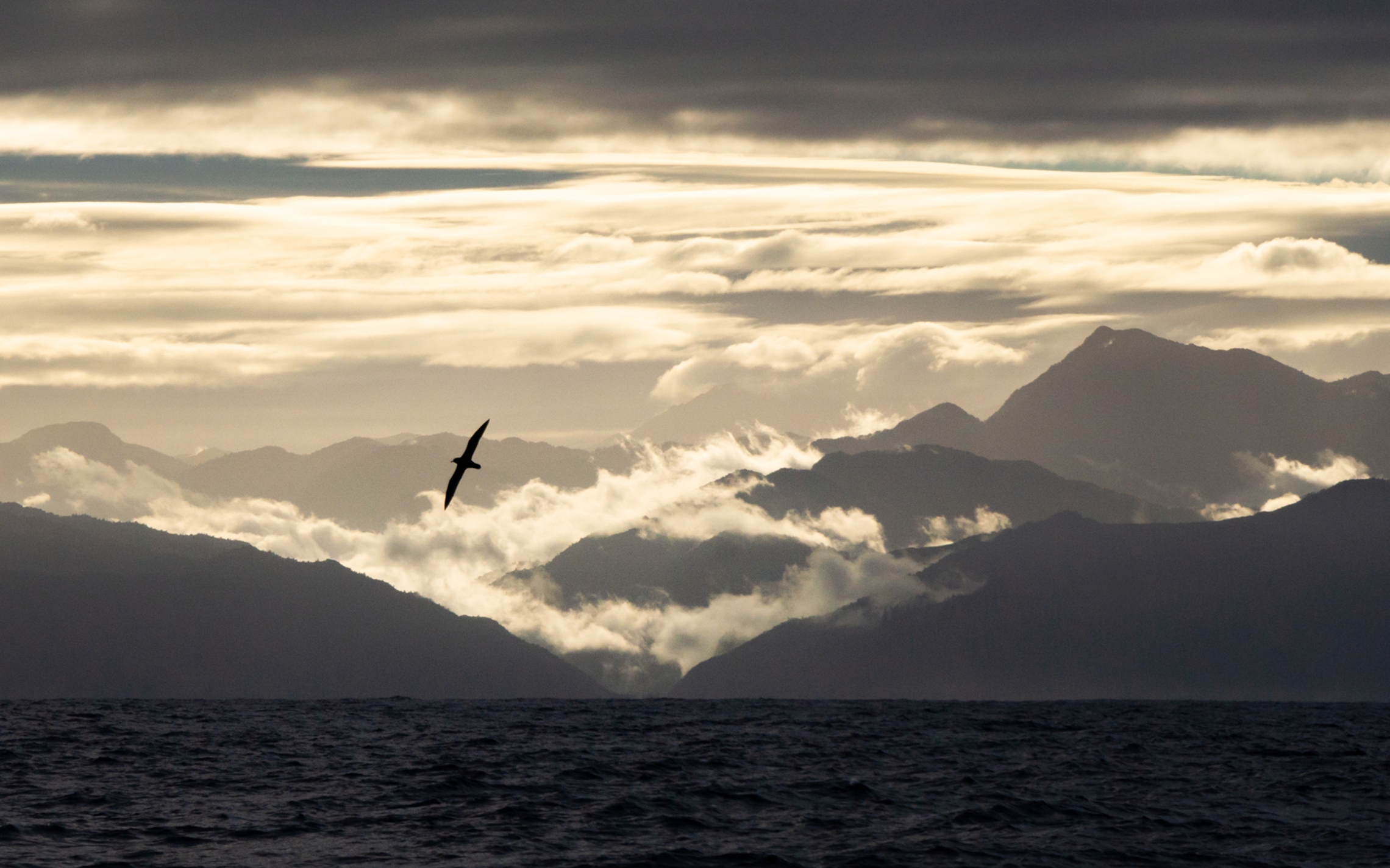 Wild mountains over sea