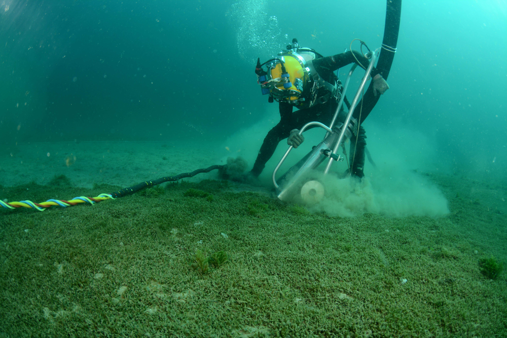Suction dredging – like vacuum cleaning the seafloor but bigger – is one of the methods divers have used to help control incursions of the invasive Caulerpa. 