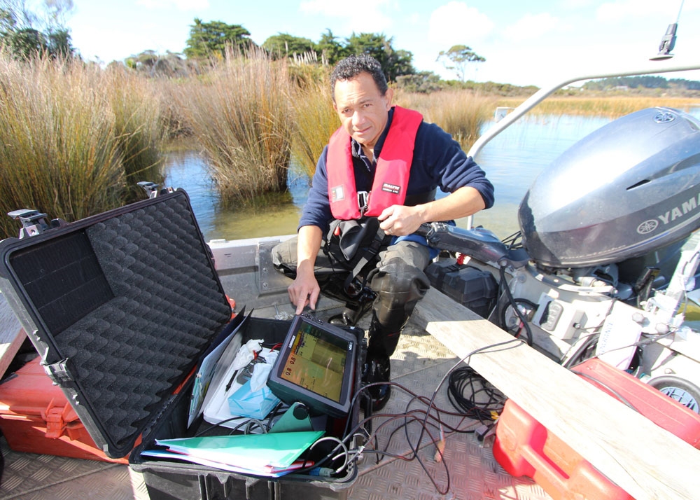 Aquatic biology technician Aleki Taumoepeau on Northland's Lake Ngatu.