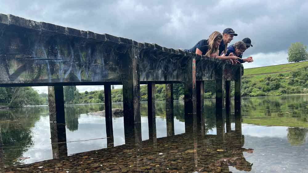 Banner image: They’re not lying down on the job; they’re scanning the lakebed for an invader. Earth Sciences NZ ecologists and visiting clam expert from Ireland, Prof. Frances Lucy, at Bob’s Landing on Lake Karāpiro. 