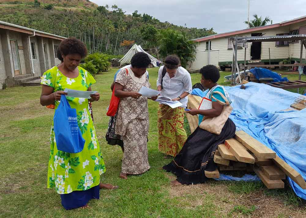 Patrina conducting community interviews in Nabukadra, Fiji.