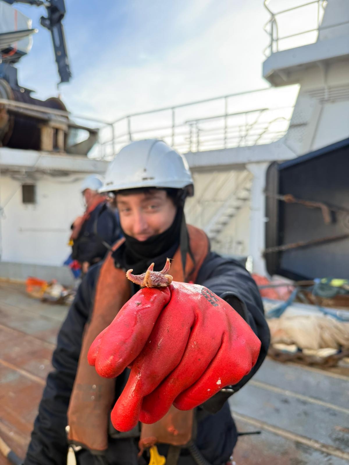 Marco Grillo holds a sea star
