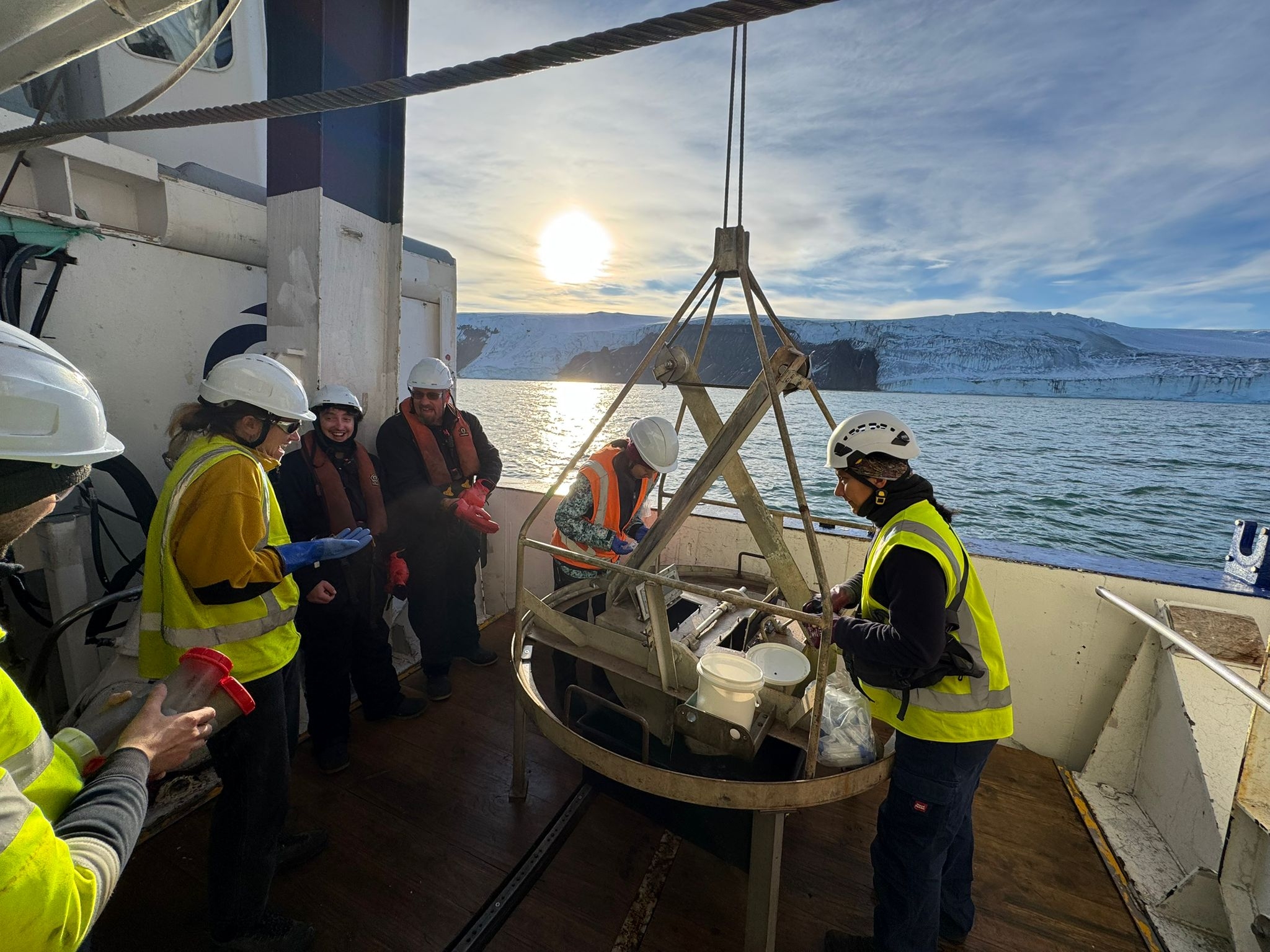Benthic team huddle around to see what has been collected