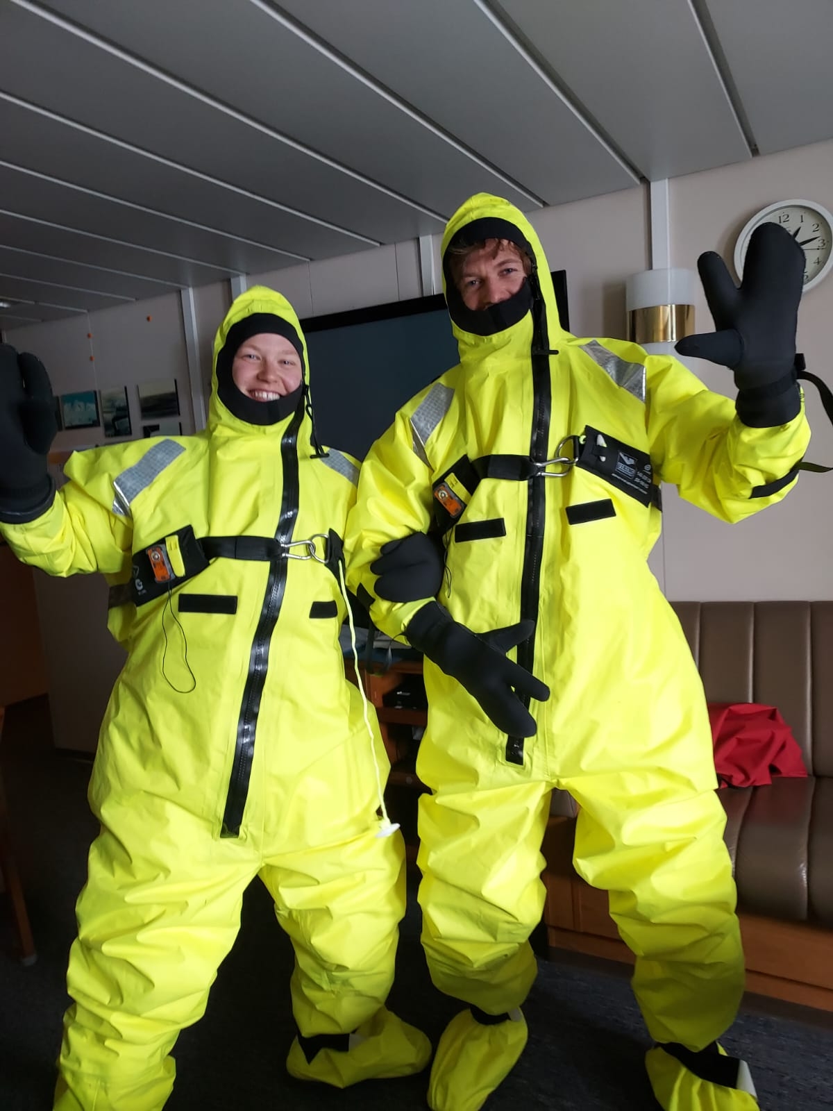 Trying on immersion suits as part of their daily drills